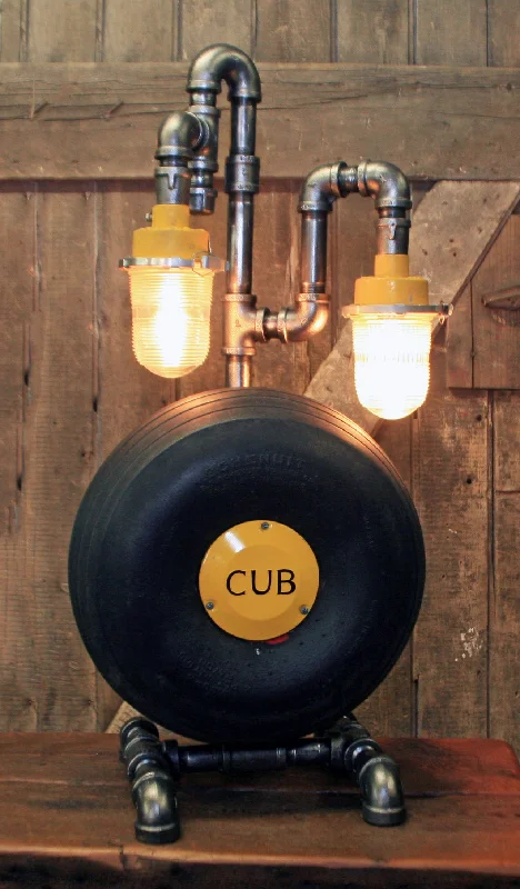 Adjustable Industrial Lighting for Flexible IlluminationSteampunk Industrial / Aviation / Vintage Airplane / Antique Piper Cub Wheel lamp / Runway lights / Schenuit Tire / Lamp #dc1000 sold