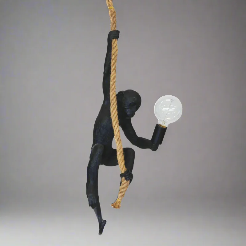 ceramic table lamps with hand painted designs for an artistic touchResin monkey on rope black