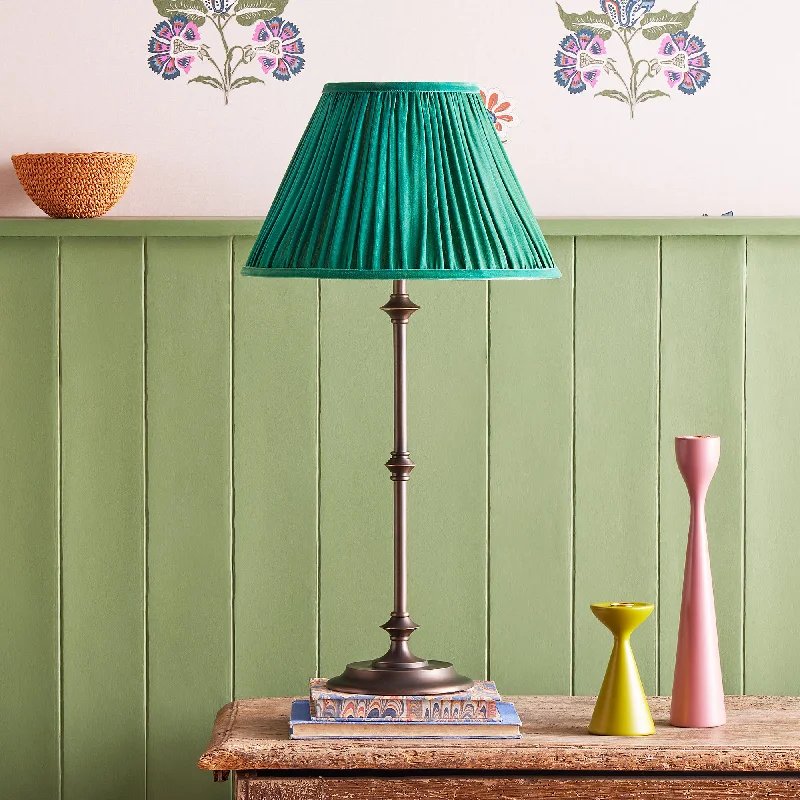 glass table lamps with a frosted surface for soft light diffusionTrindle table lamp in brass with a bronze finish